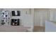 Inviting bonus room features carpet, neutral walls, tv, shelves, and a double door at 3419 In Bloom Way, Auburn, GA 30011