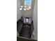 Bright foyer with a chandelier, hardwood floors, and a view of the front door and upper-level window at 3419 In Bloom Way, Auburn, GA 30011