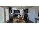 Eat-in kitchen featuring dark cabinets, tile backsplash, and a glass table at 3419 In Bloom Way, Auburn, GA 30011