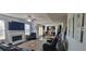 Open-concept living area with fireplace, leading into the dining and kitchen area with ample natural light at 3419 In Bloom Way, Auburn, GA 30011