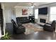 Cozy living room with a fireplace, large windows, and comfortable seating, ideal for Gathering gatherings at 3419 In Bloom Way, Auburn, GA 30011