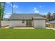 Picture of backyard featuring a spacious lawn, a deck, and modern exterior at 3470 Glenwood Rd, Decatur, GA 30032