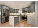 Modern kitchen featuring stainless steel appliances, stylish gray cabinetry, and a sleek center island at 3470 Glenwood Rd, Decatur, GA 30032