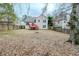 Spacious fenced backyard with a wooden deck, perfect for outdoor entertaining at 4096 Mistymorn Ln, Powder Springs, GA 30127
