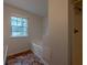 Bright bathroom featuring a garden tub with a large window and unique tile flooring at 4096 Mistymorn Ln, Powder Springs, GA 30127