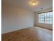Cozy bedroom with a window providing natural light, wood laminate flooring at 4096 Mistymorn Ln, Powder Springs, GA 30127