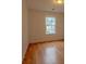 Bright bedroom featuring hardwood floors and ample natural light at 4096 Mistymorn Ln, Powder Springs, GA 30127
