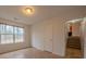 Bedroom featuring laminate floors, a bright window, and two closets at 4096 Mistymorn Ln, Powder Springs, GA 30127
