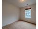 Cozy bedroom featuring natural light from a window and carpeted flooring at 4096 Mistymorn Ln, Powder Springs, GA 30127