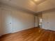 Spacious bedroom featuring hardwood floors and closet space at 4096 Mistymorn Ln, Powder Springs, GA 30127
