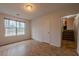 Bedroom featuring laminate floors, a bright window, and two closets at 4096 Mistymorn Ln, Powder Springs, GA 30127