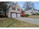 Lovely two-story home with brick facade, attached 2-car garage, and well-kept lawn at 4096 Mistymorn Ln, Powder Springs, GA 30127
