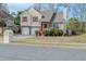Charming two-story home with a two-car garage and inviting red porch steps at 4096 Mistymorn Ln, Powder Springs, GA 30127
