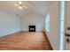 Bright living room featuring hardwood floors, a fireplace, and large windows at 4096 Mistymorn Ln, Powder Springs, GA 30127