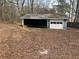 Detached outbuilding offering ample space for storage or workshop at 9588 Poston Rd, Jonesboro, GA 30238