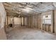 Unfinished basement with exposed insulation and framing awaiting customization to suit buyer's unique needs at 3367 Spring Meadow Ct, Tucker, GA 30084