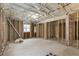 Unfinished basement space featuring exposed beams, insulation, and window, offering potential for customization at 3367 Spring Meadow Ct, Tucker, GA 30084