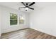 Bright bedroom with wood-look floors and large windows offering a view of the outdoors at 3367 Spring Meadow Ct, Tucker, GA 30084