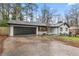 Wide driveway leading to a painted brick home with an attached garage at 3367 Spring Meadow Ct, Tucker, GA 30084