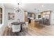 Modern kitchen and dining area featuring stainless steel appliances and a stylish island with seating at 3367 Spring Meadow Ct, Tucker, GA 30084