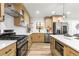 Bright kitchen featuring stainless steel appliances, light wood cabinetry, and a quartz countertop at 3367 Spring Meadow Ct, Tucker, GA 30084