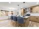 Inviting kitchen with breakfast bar, stainless appliances, and seamless flow into the dining area at 3367 Spring Meadow Ct, Tucker, GA 30084