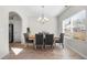 Elegant dining room with wood floors, chandelier, and windows providing natural light at 461 Charleston Pl, Villa Rica, GA 30180