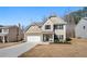 Charming two-story home featuring stone accents, neutral siding, and an attached two-car garage at 461 Charleston Pl, Villa Rica, GA 30180