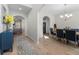 Welcoming foyer with wood flooring, arched doorways, leading to the dining and living areas at 461 Charleston Pl, Villa Rica, GA 30180