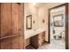 Bathroom featuring a single sink vanity and adjacent shower at 4722 Bexley Dr, Stone Mountain, GA 30083