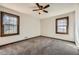 Bedroom featuring carpeting, a ceiling fan and two windows at 4722 Bexley Dr, Stone Mountain, GA 30083