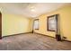 Sunny bedroom features yellow walls, carpeting, two windows and natural light at 4722 Bexley Dr, Stone Mountain, GA 30083