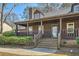 Welcoming covered front porch with stairs leading to the main entrance of the home at 4722 Bexley Dr, Stone Mountain, GA 30083