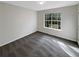 Carpeted bedroom with a large window showing the green trees outside at 521 Country Lake Dr, Mcdonough, GA 30252