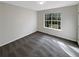 This carpeted bedroom has a window for natural light at 521 Country Lake Dr, Mcdonough, GA 30252