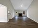 Open living room with vaulted ceiling and stone fireplace, perfect for gathering at 521 Country Lake Dr, Mcdonough, GA 30252