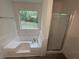 Bathroom featuring a large tub and separate shower at 521 Country Lake Dr, Mcdonough, GA 30252