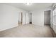 Bedroom with neutral walls, carpet flooring, a ceiling light, and a view of two doorways at 667 Creswell Park, Smyrna, GA 30082