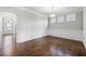 Inviting dining room featuring hardwood floors, wainscoting, and elegant lighting for memorable meals at 667 Creswell Park, Smyrna, GA 30082