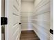 Walk-in pantry featuring ample white wire shelving for organized storage at 92 Harmony Woods Dr, Dallas, GA 30157