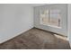 Bedroom with carpet flooring, neutral walls, and a window at 212 Riverstone Commons Cir, Canton, GA 30114