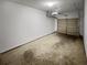 Spacious garage with neutral walls and concrete floor at 212 Riverstone Commons Cir, Canton, GA 30114