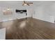 Open-concept living room with tile flooring, neutral walls, and a ceiling fan at 212 Riverstone Commons Cir, Canton, GA 30114