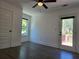 Bright bedroom featuring a ceiling fan, neutral tones, and access to a private outdoor deck at 2173 Montrose Sw Ave, Atlanta, GA 30311