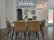 Elegant dining area with modern lighting and a view of the outdoors at 2173 Montrose Sw Ave, Atlanta, GA 30311
