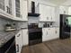 Well-equipped kitchen with stainless steel appliances and stylish backsplash at 2173 Montrose Sw Ave, Atlanta, GA 30311