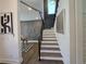Stylish staircase and adjacent office space featuring eye-catching accent wall and modern decor at 2173 Montrose Sw Ave, Atlanta, GA 30311