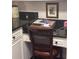 Compact desk area with granite countertop and white cabinetry at 3530 Piedmont Ne Rd # I3, Atlanta, GA 30305