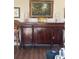 Elegant mahogany sideboard in the dining room with hardwood floors at 3530 Piedmont Ne Rd # I3, Atlanta, GA 30305