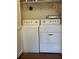 Convenient laundry room features a new white washer and dryer combo at 3530 Piedmont Ne Rd # 3I, Atlanta, GA 30305